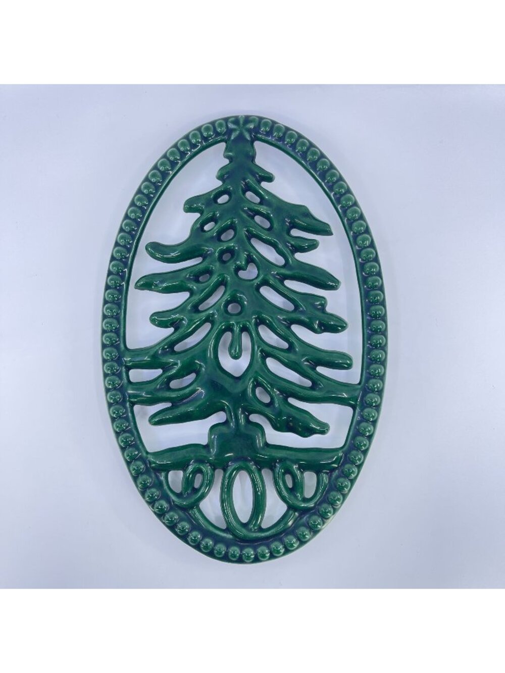 vintage green oval cast iron trivet with christmas tree design made in france